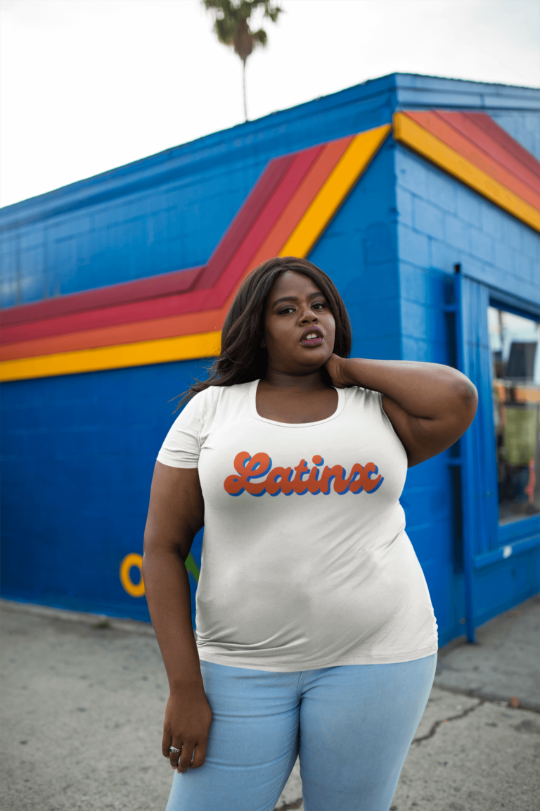 plus size round neck t shirt latinx latina black afro latina woman outside a blue and orange store 768x1152